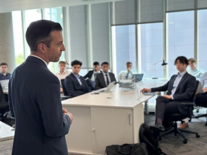 Instructor leading a seminar for finance students